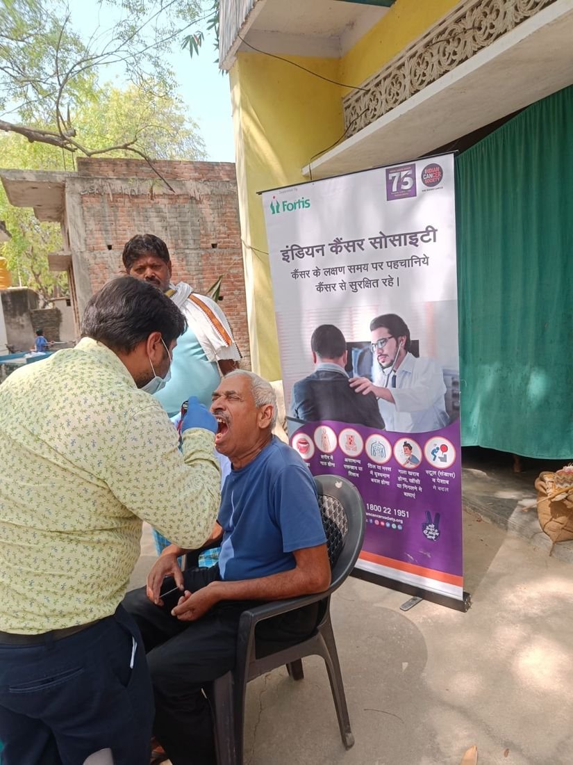 An oral cancer screening at a community camp