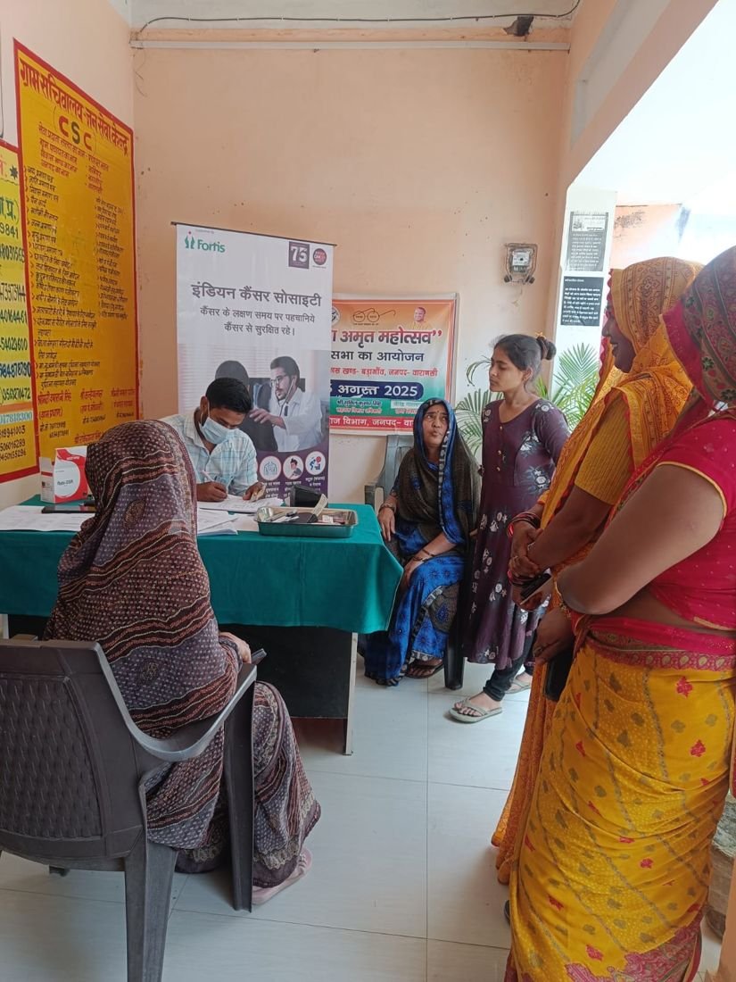 People waiting at a community health screening camp