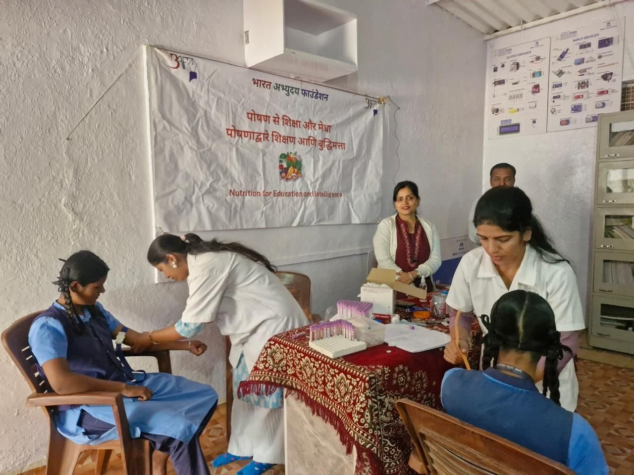 Students having blood tests at a BAF Nutrition for Education and Intelligence camp